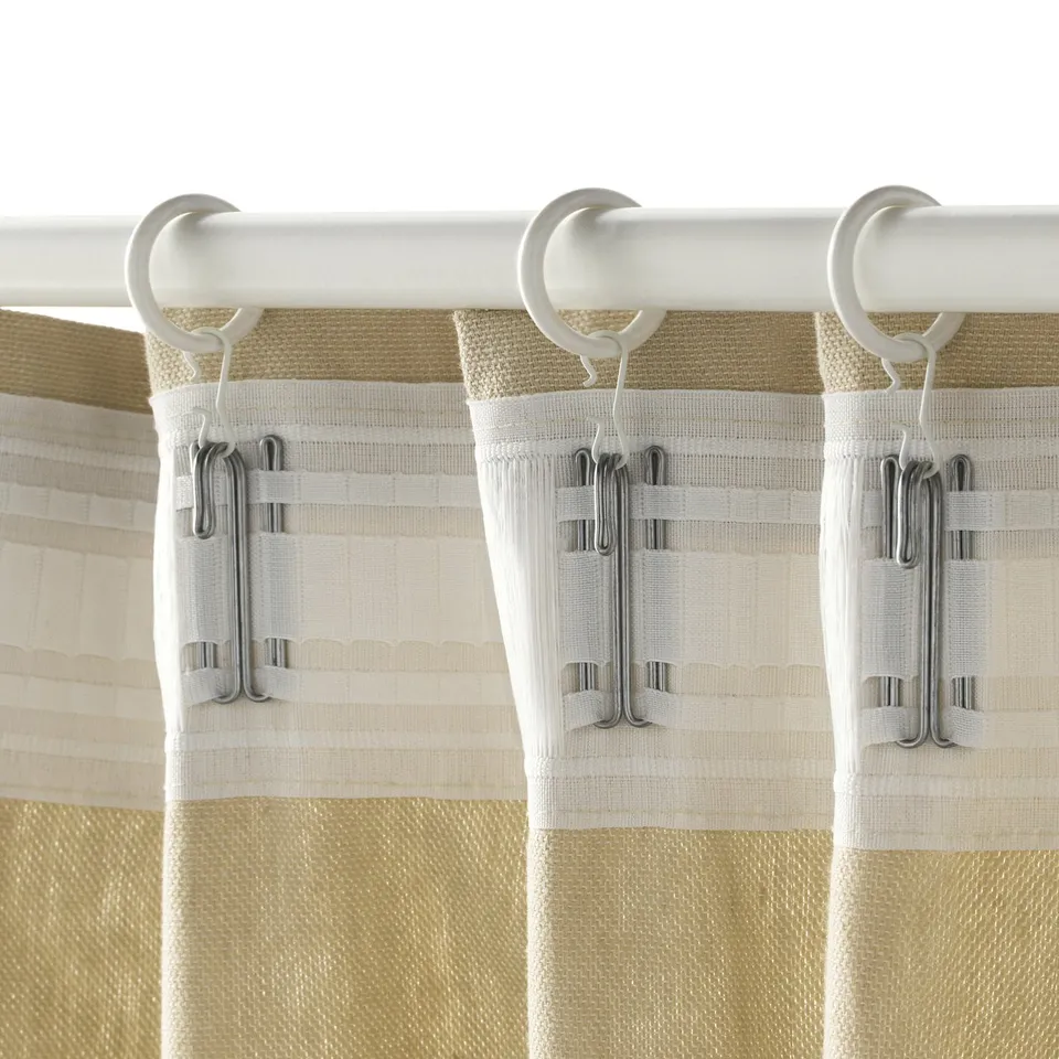 Image shows curtain rings with hooks hanging window curtains, demonstrating their easy slide function.