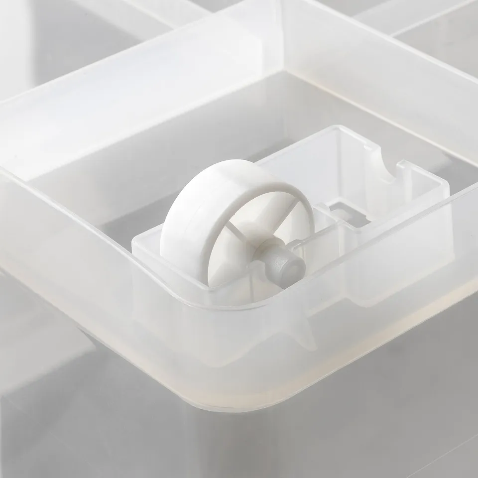 Close-up of a transparent plastic storage box with wheels for easy transport.