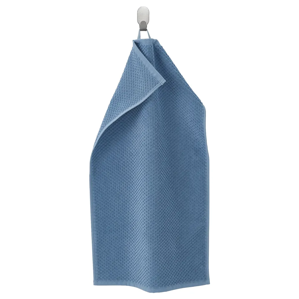 Blue GULVIAL towel hanging: soft, cotton, textured.