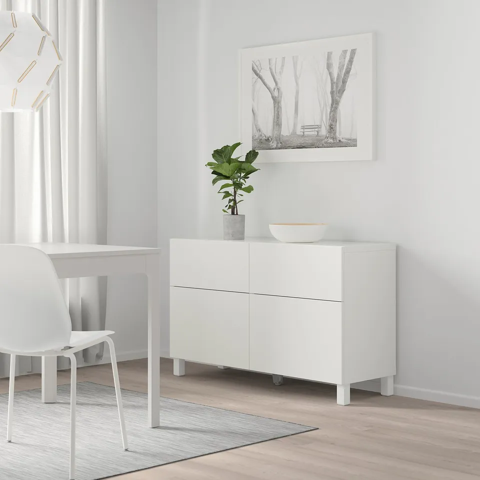Contemporary living room with BESTÅ, plant, bowl, forest art