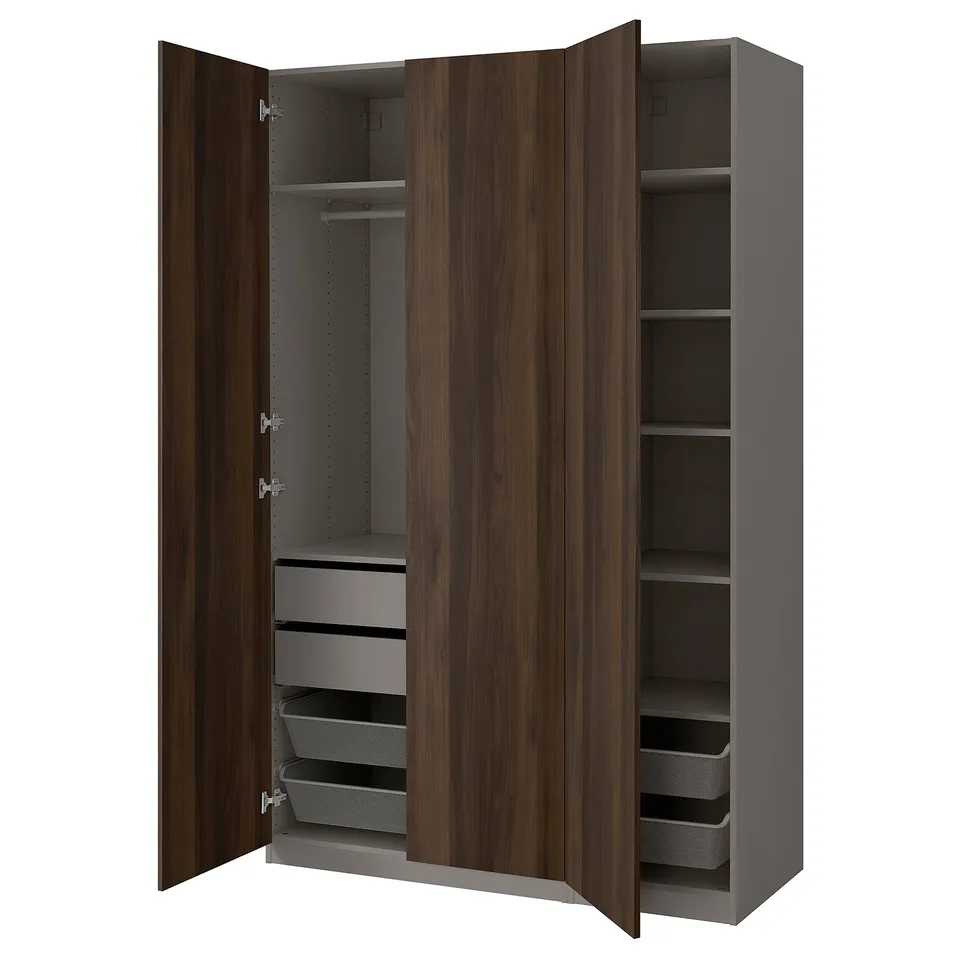 PAX wardrobe: tall, dark brown, with wooden doors, soft-close hinges, mesh baskets, and multiple shelves for organised storage.