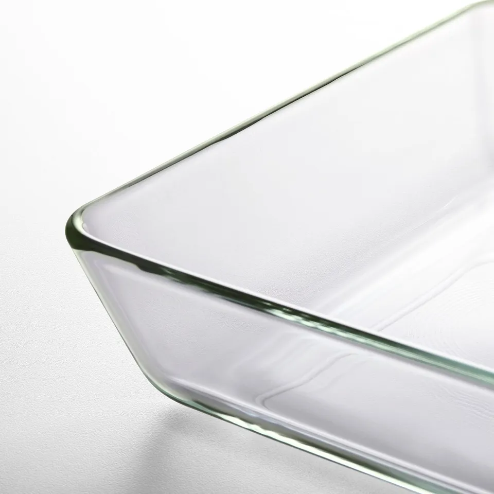 Flat, clear glass dish with smooth edges, showcasing transparency and sleek design.