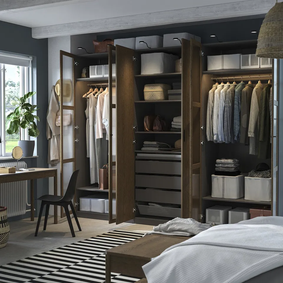 Advanced closet system with integrated lighting, shelves, and hanging space, featuring pull-out trays and adjustable feet.