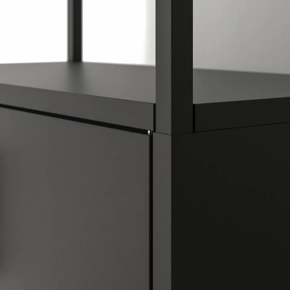 Modern black metal cabinet detail, showcasing sleek design and durable finish.