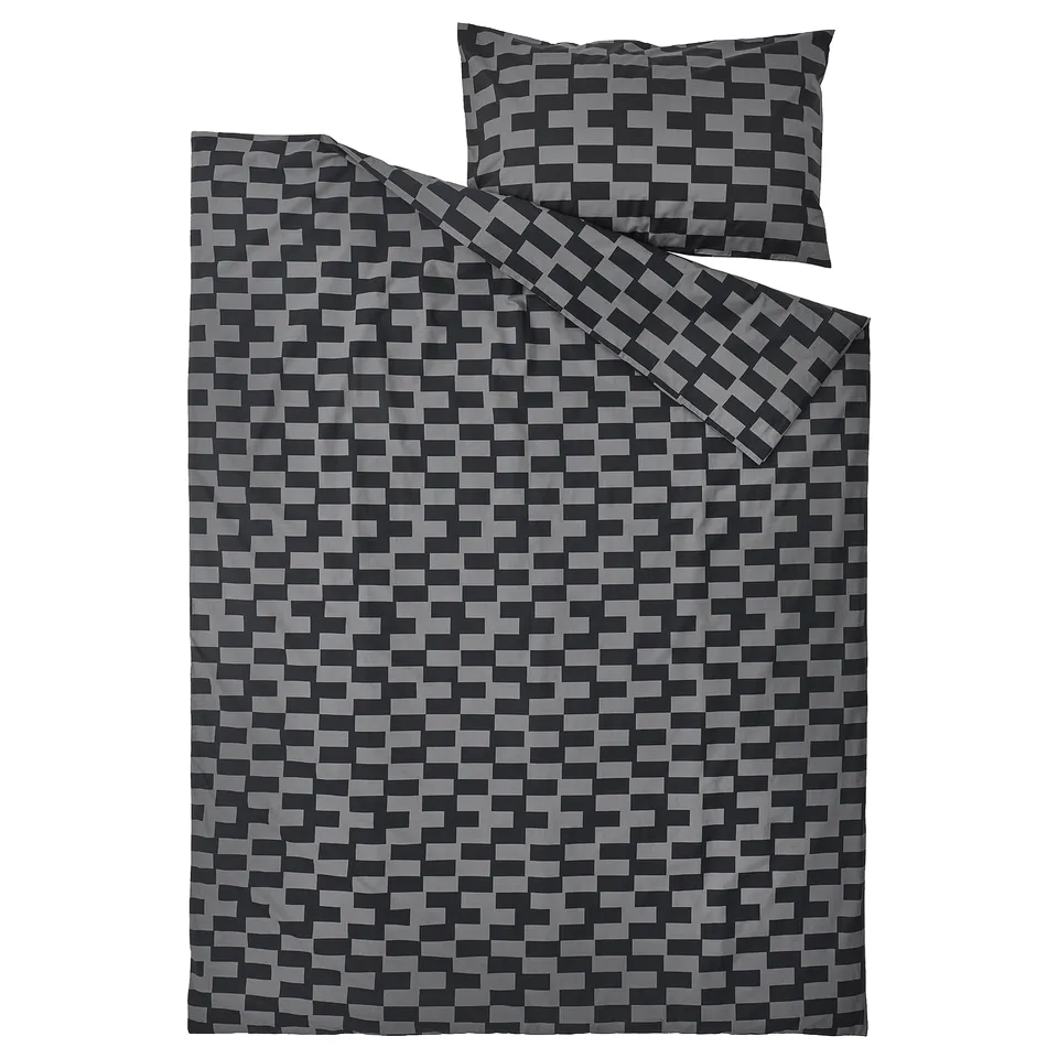 Black and grey chequered duvet and pillowcase set featuring a modern pixelated pattern, ideal for teens, made from soft cotton-blend fabric.