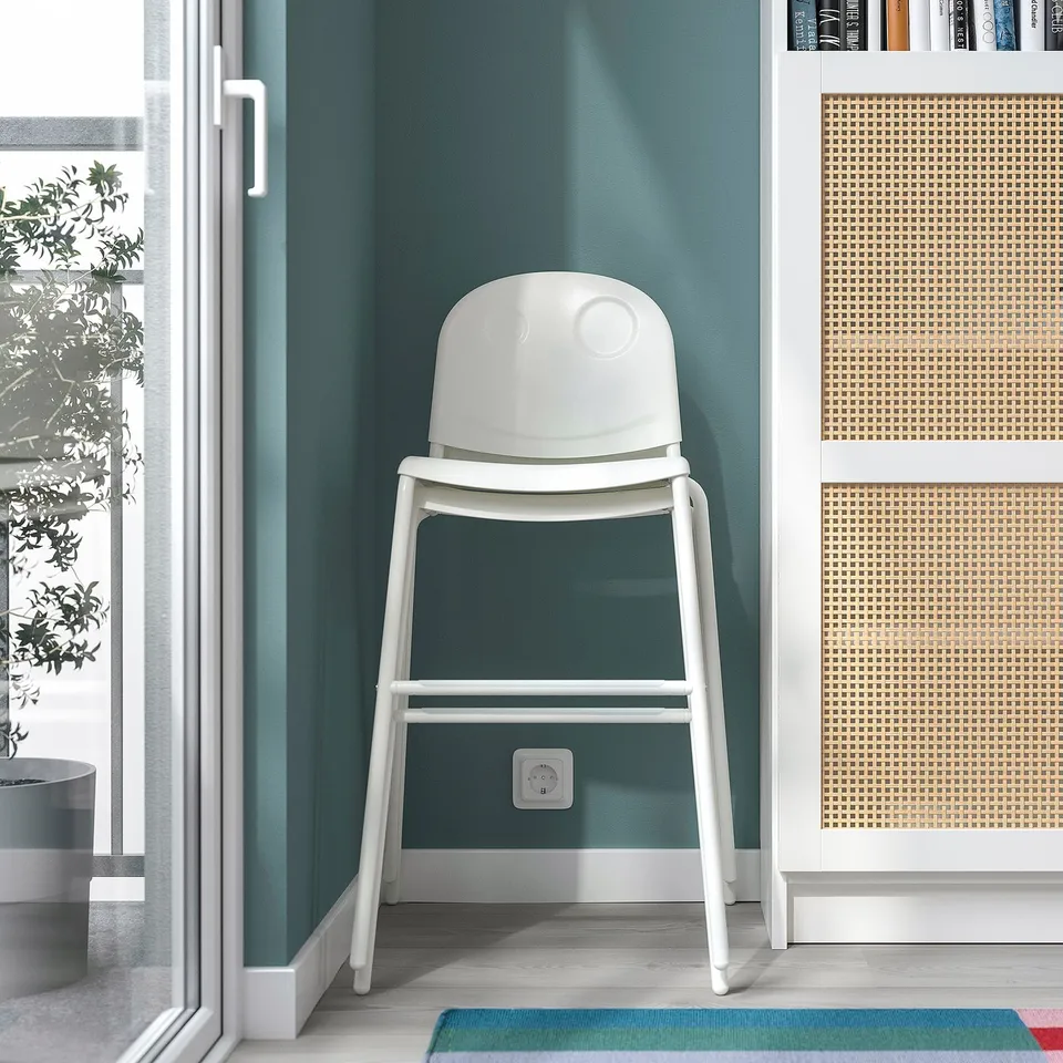 Junior chair vs green wall, stackable for kids.