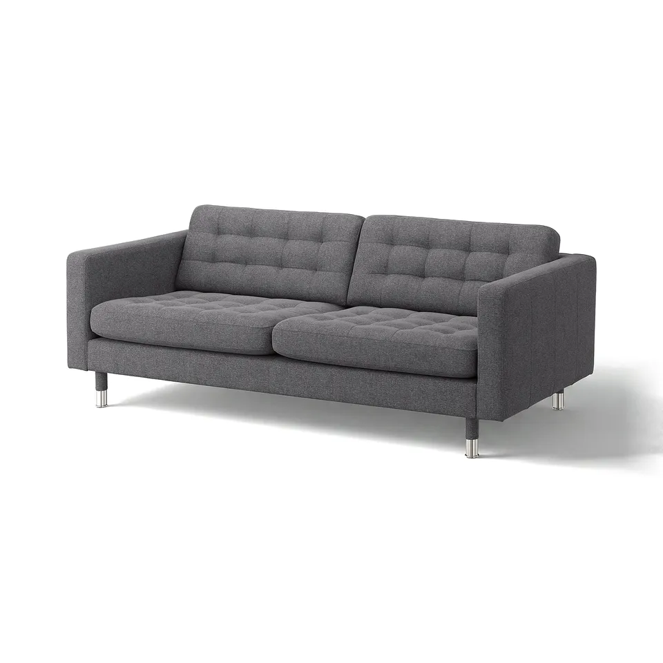 Dark grey modern sofa with tufted back and seat cushions, chrome legs.