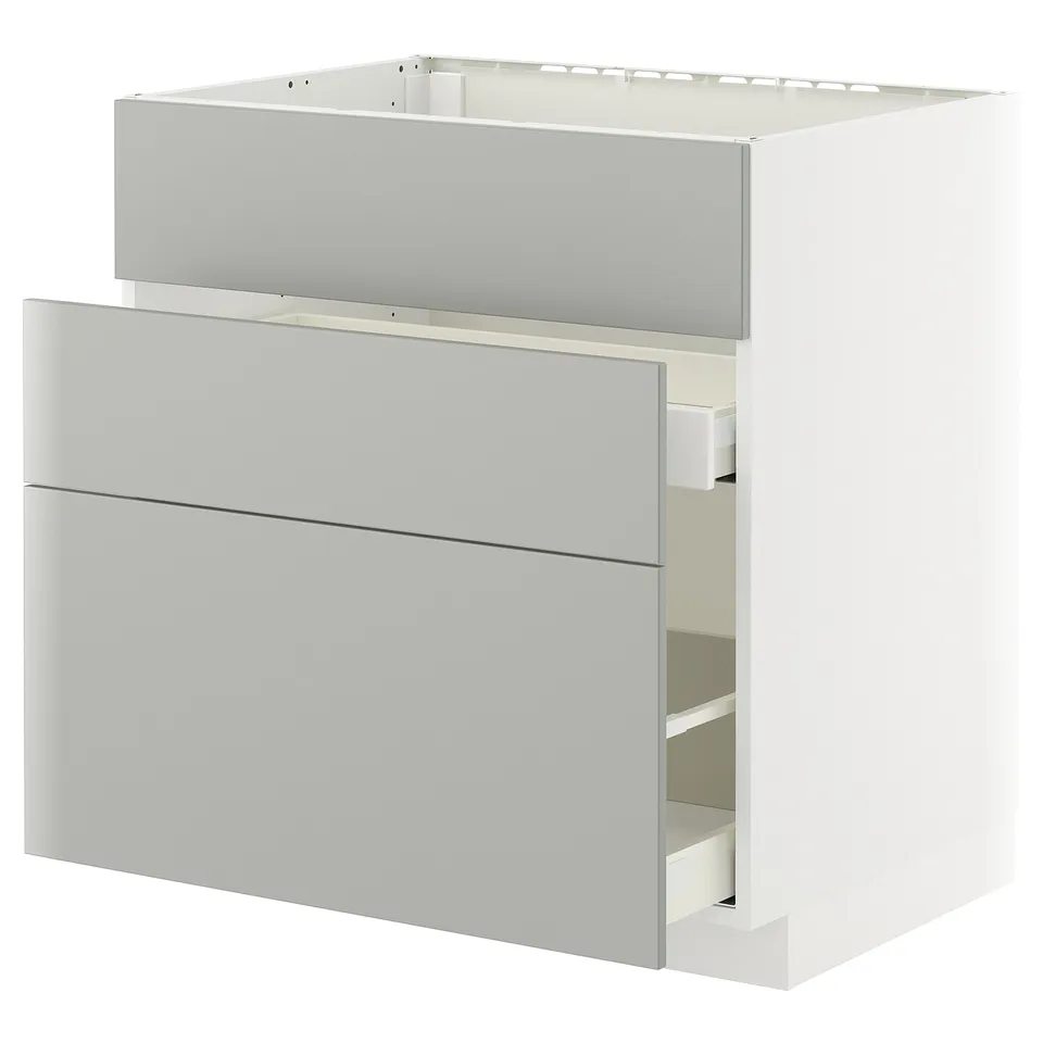 Modern light grey kitchen cabinet with drawers, part of IKEAs METOD system, clean minimalist design.