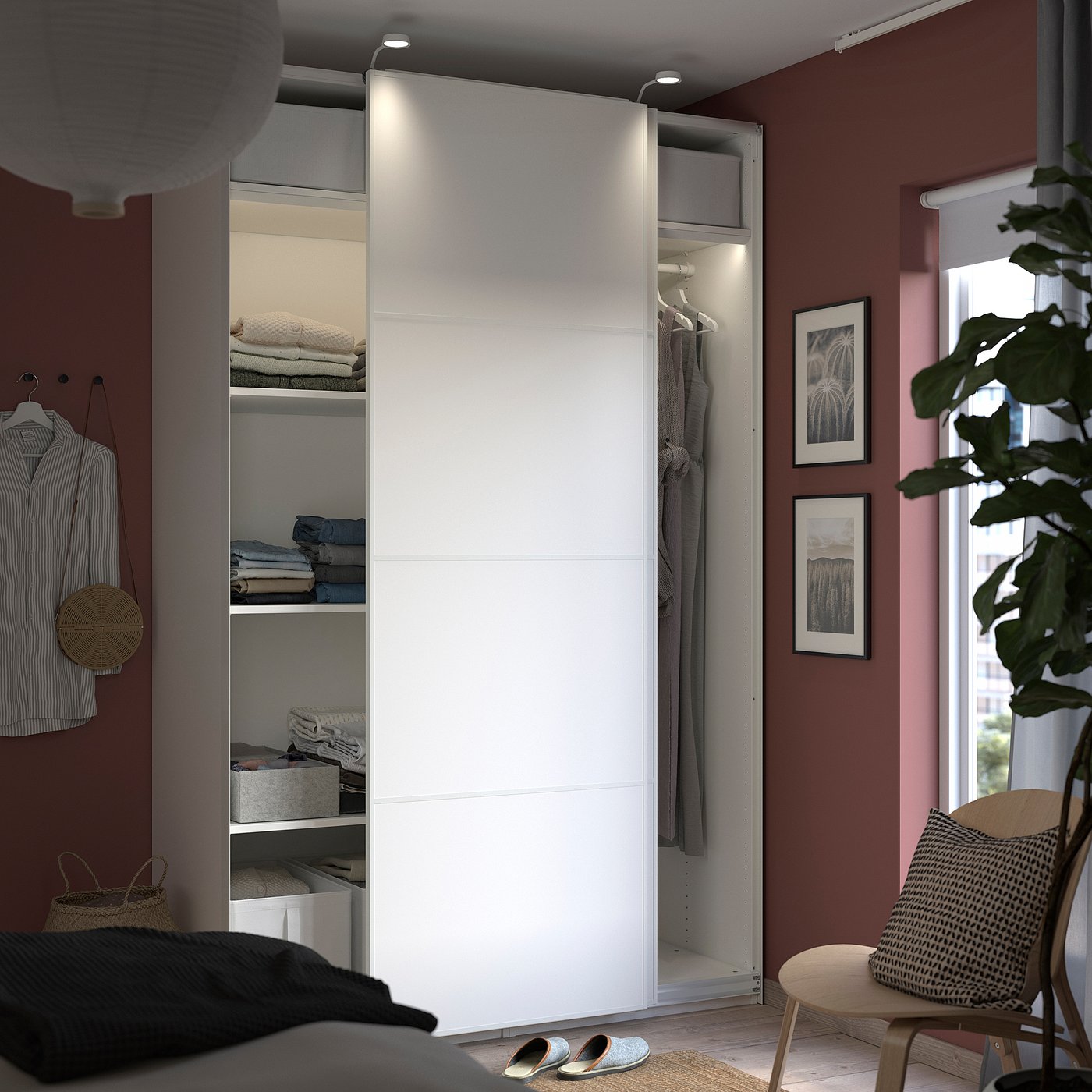 Modern bedroom with white wardrobe and organised clothes.