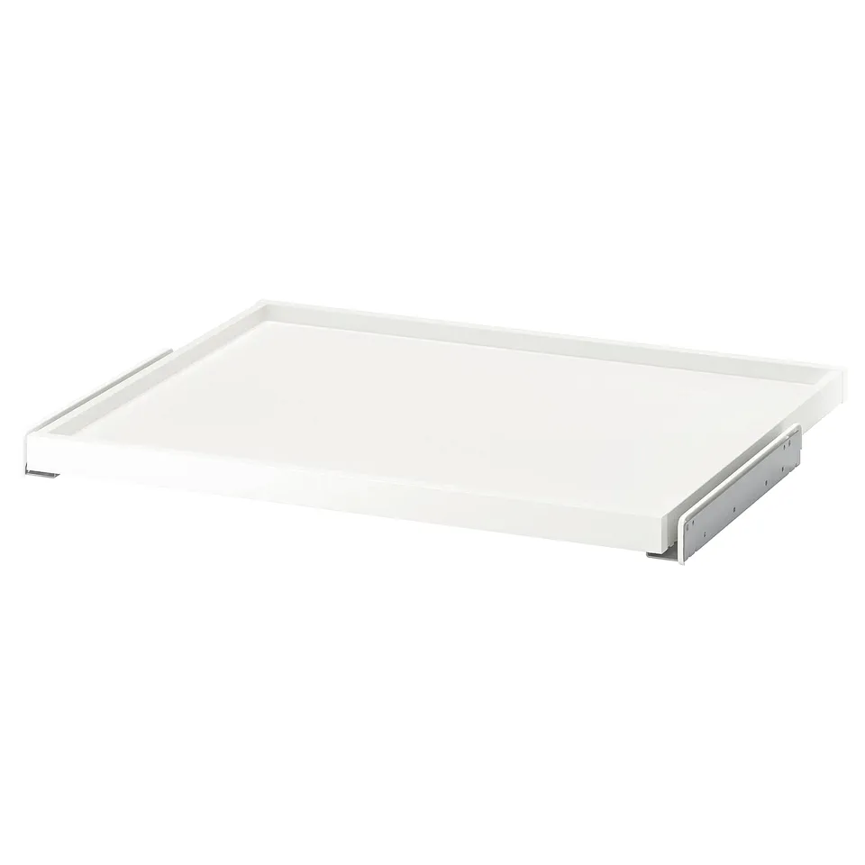 A white KOMPLEMENT pull-out shelf. The shelf is rectangular with a sleek, minimalist design, ideal for wardrobe storage.