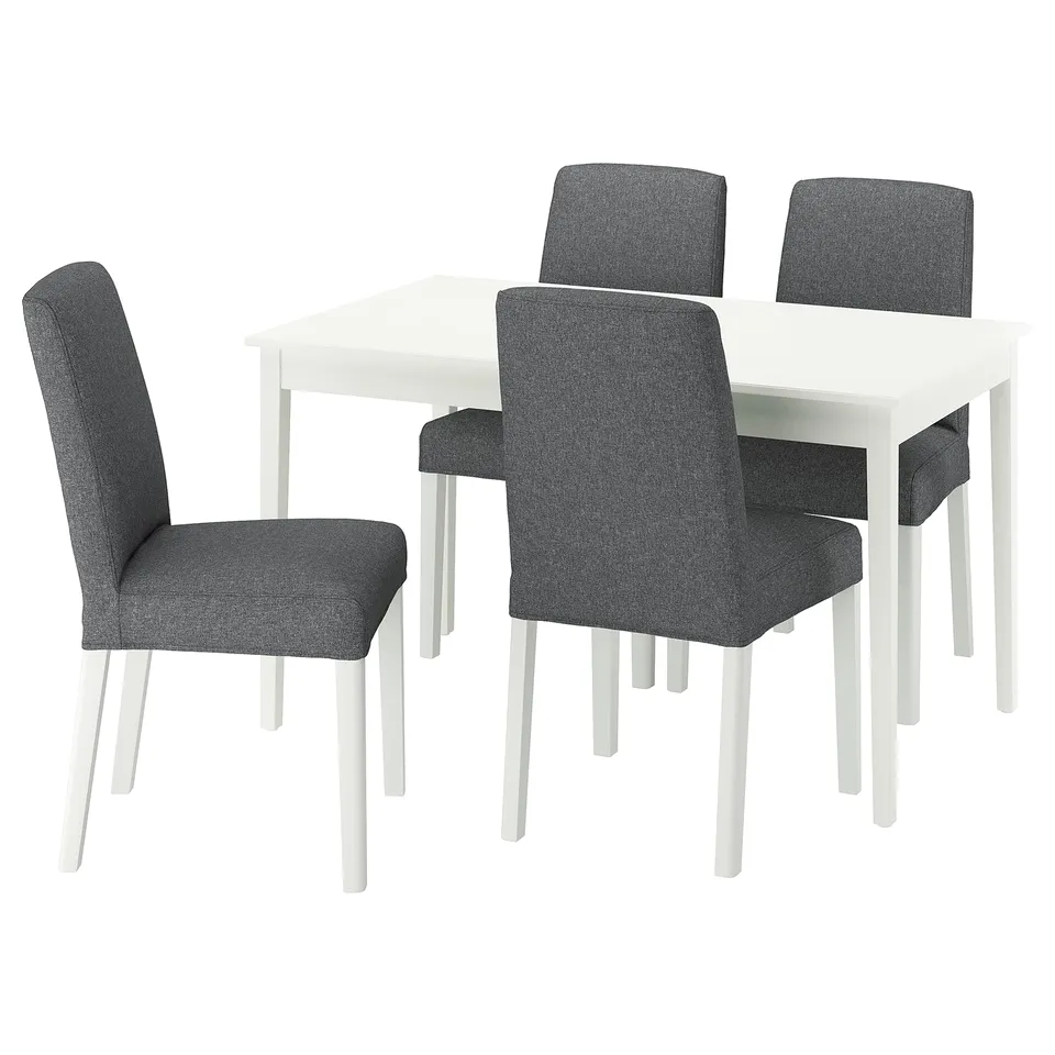 White rectangular dining table with four grey fabric chairs, featuring simple design and matching table.