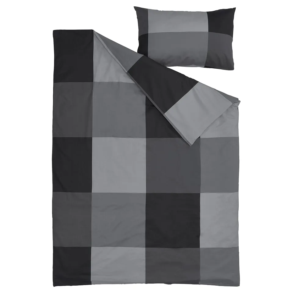 A grey BRUNKRISSLA duvet cover and pillowcase set, featuring a chequered design. Made of cotton and viscose.