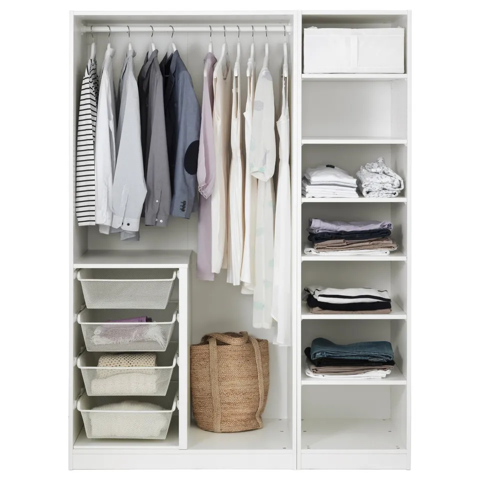 Organised closet with hanging shirts, folded clothes, baskets, and shelves.