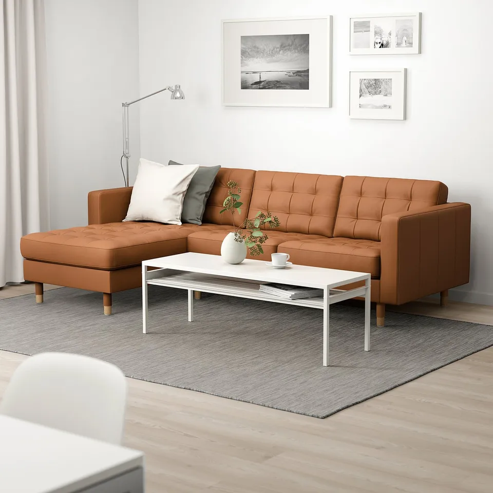 Modern living room with large l-shaped sofa, coffee table, rug, and wall art.