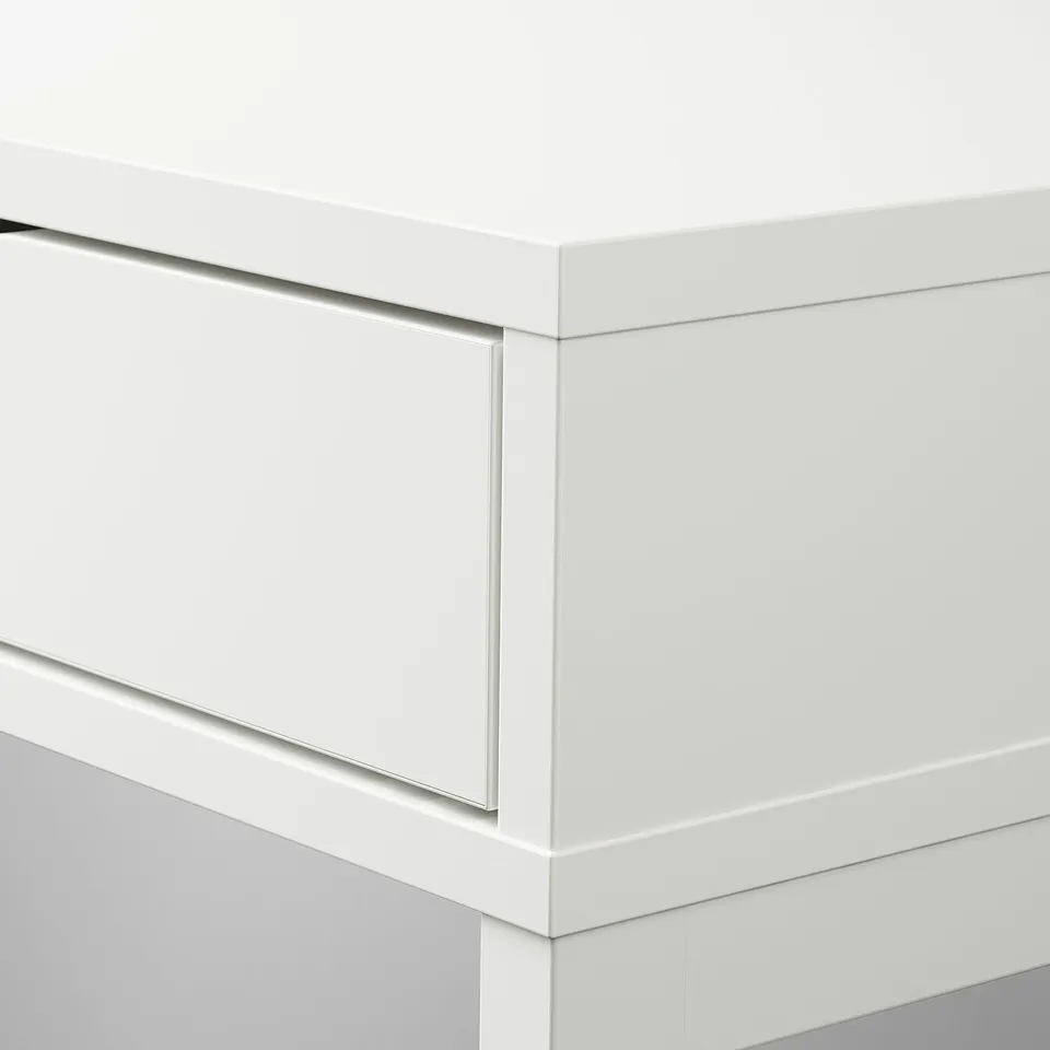 Modern white desk with sleek edges and built-in drawers for tidy storage. High-quality materials and minimalist design.