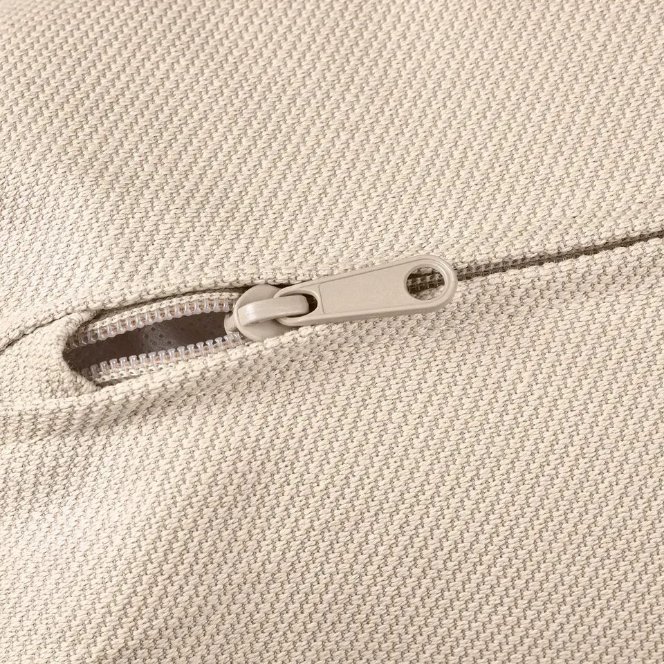 Close-up of zip on soft, high-quality textured fabric.