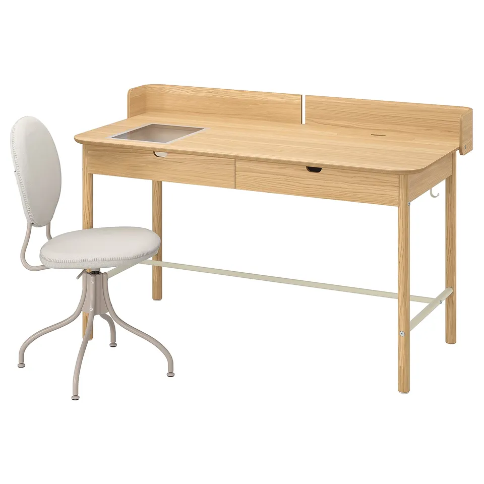 A light wooden desk with a single drawer and a glass top, accompanied by a cushioned white swivel chair with a light grey base.
