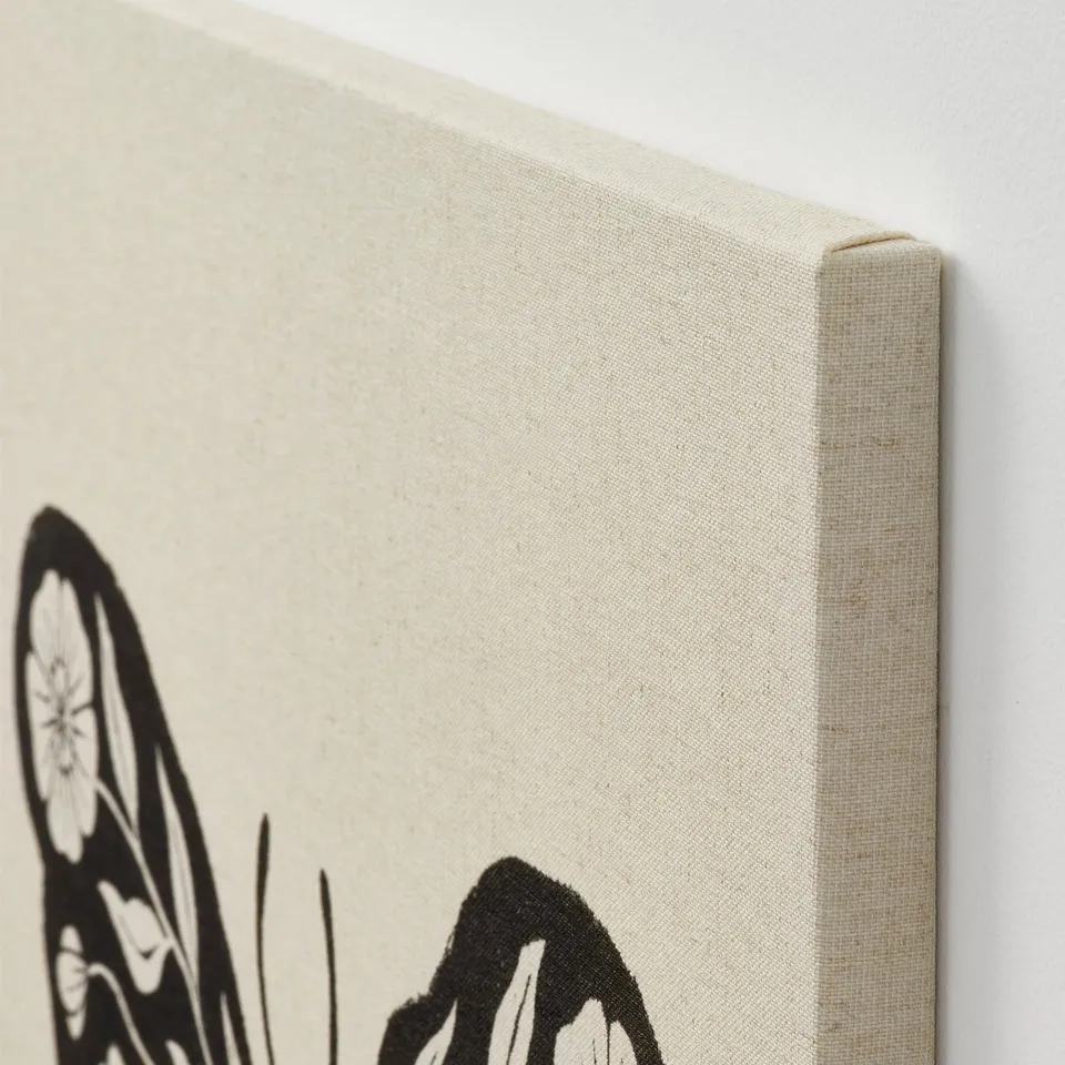 Close-up of canvas art with crisp black-and-white print. Deep frame creates a 3d effect. Rustic texture visible.