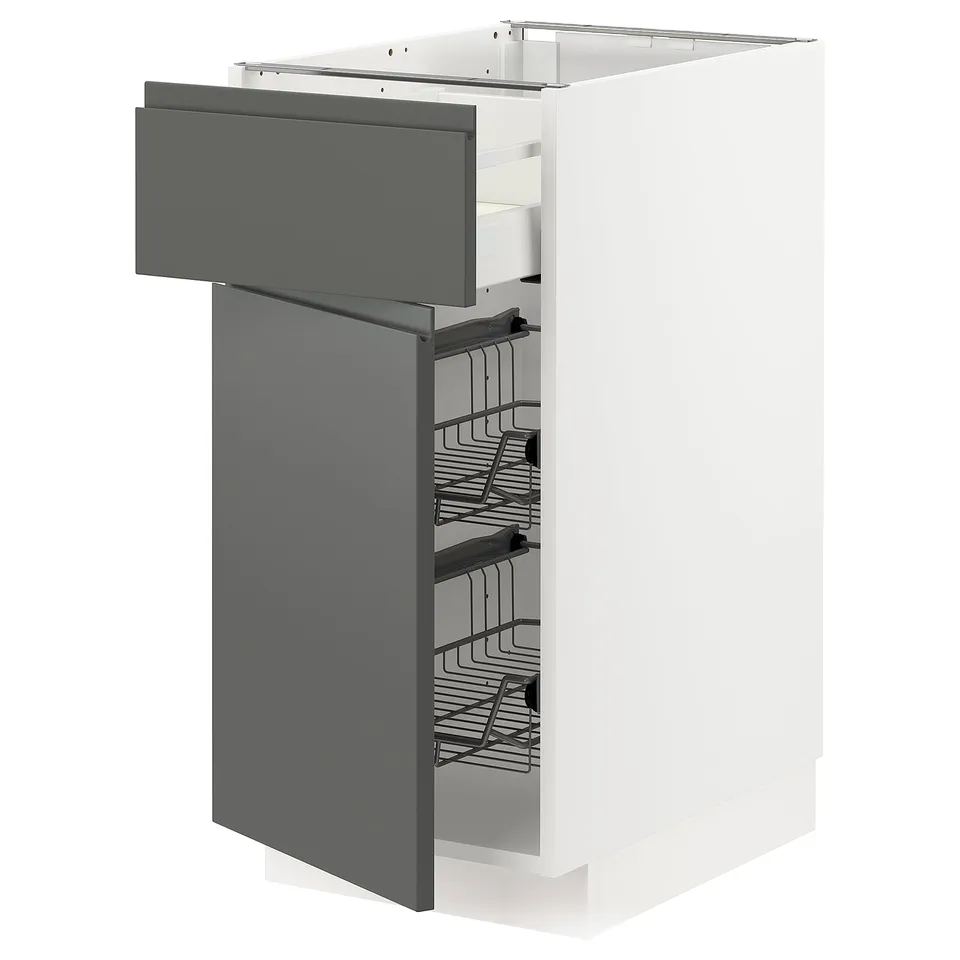 Modern kitchen cabinet in white with dark grey pull-out drawer, wire baskets, sleek handles.