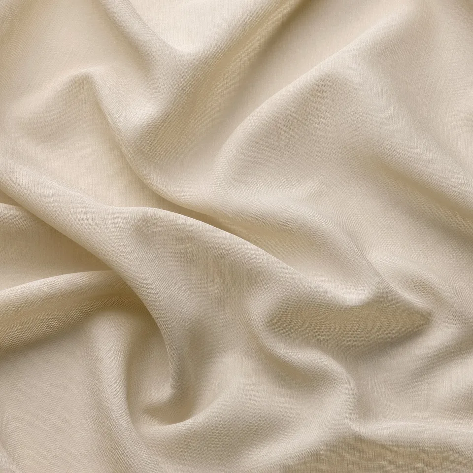 Delicate beige sheer curtain fabric, softly draped, highlights quality and light filtering.