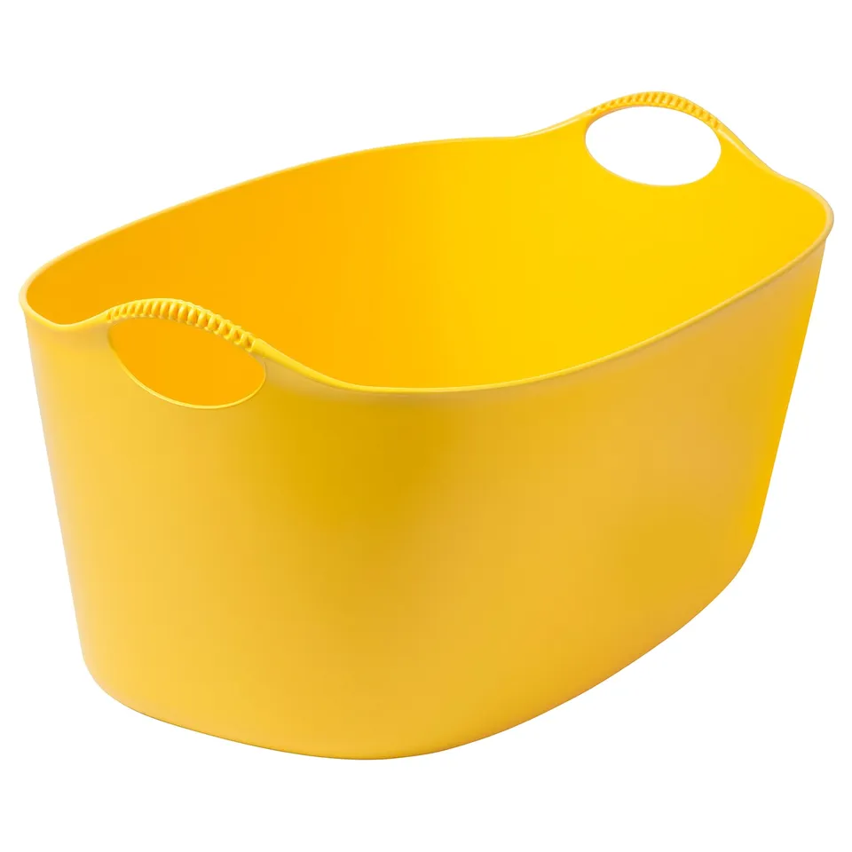 Bright yellow TORKIS flexi laundry basket, oval-shaped with handles, made of durable polyethylene plastic.