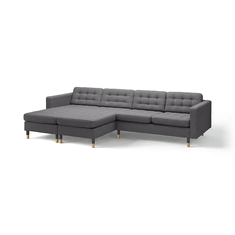 Modern grey l-shaped sofa with tufted back and seat, wooden legs, minimalist design.