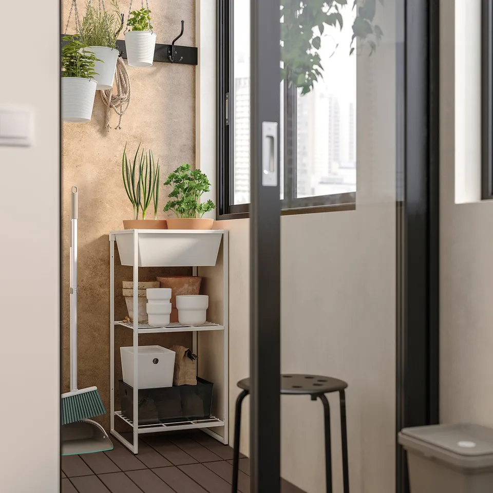 Small indoor/outdoor storage shelf. White JOSTEIN unit holds pots and supplies. Made of powder-coated steel.