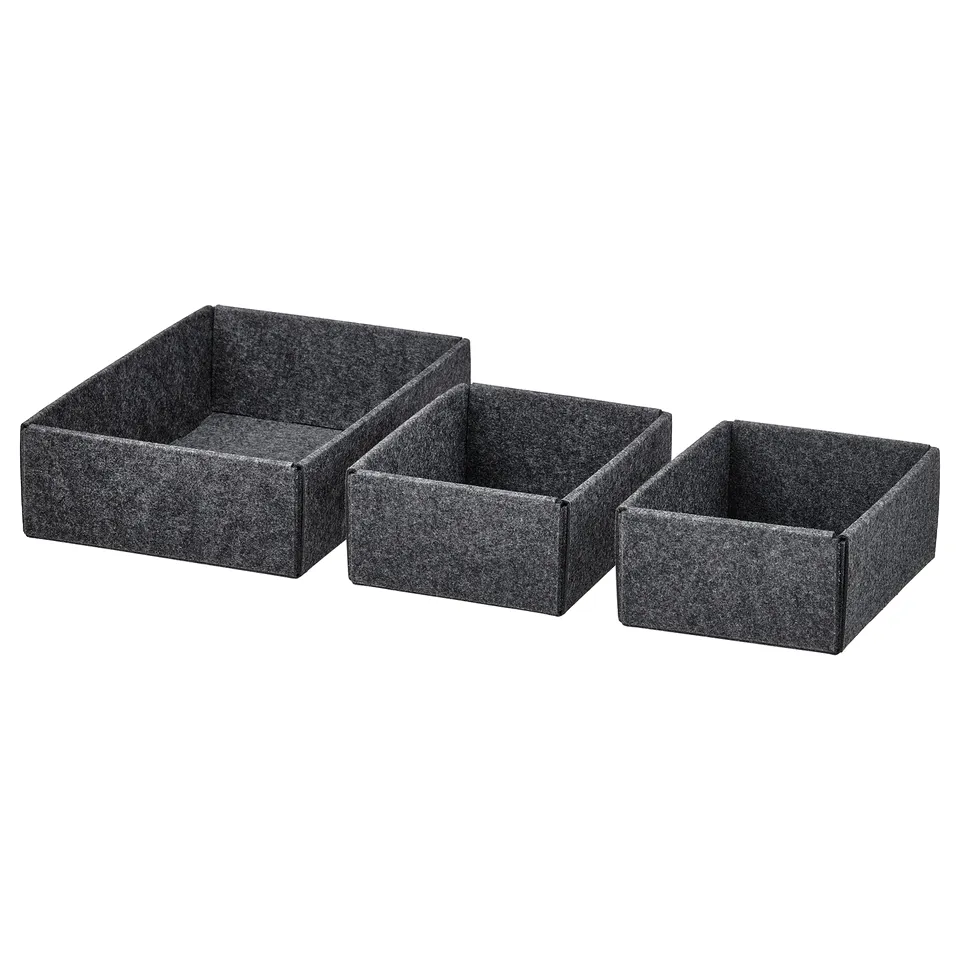 Three grey rectangular felt organising boxes, varying in size, stacked in a row.