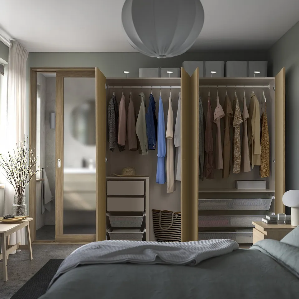 Modern wardrobe with open doors showing clothes and adjustable storage.
