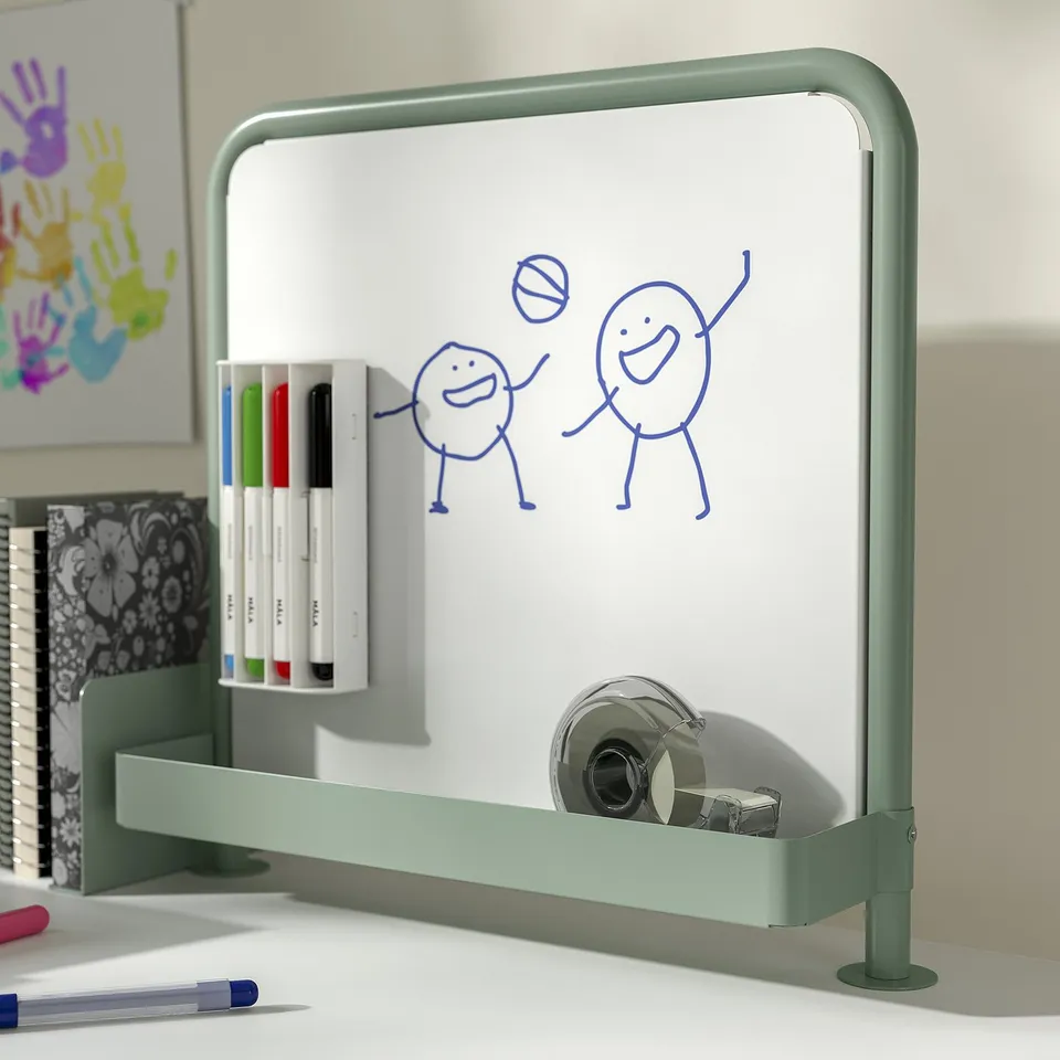 Green kids desk with magnetic whiteboard, markers, and drawings. Includes height-adjustable crank and storage compartments.