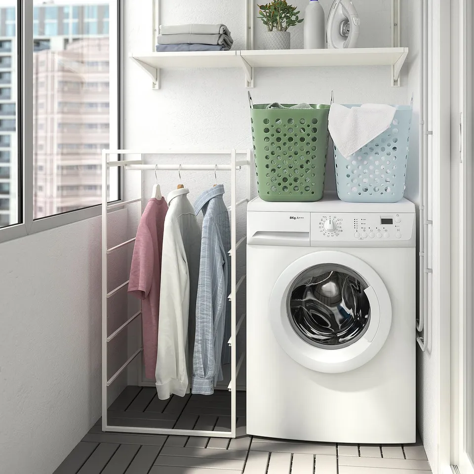 Laundry setup with washer, dryer, and storage baskets