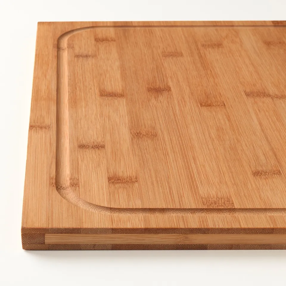 Lämpig bamboo chopping board shown, clean, well-crafted, smooth surface with juice groove, quality design.