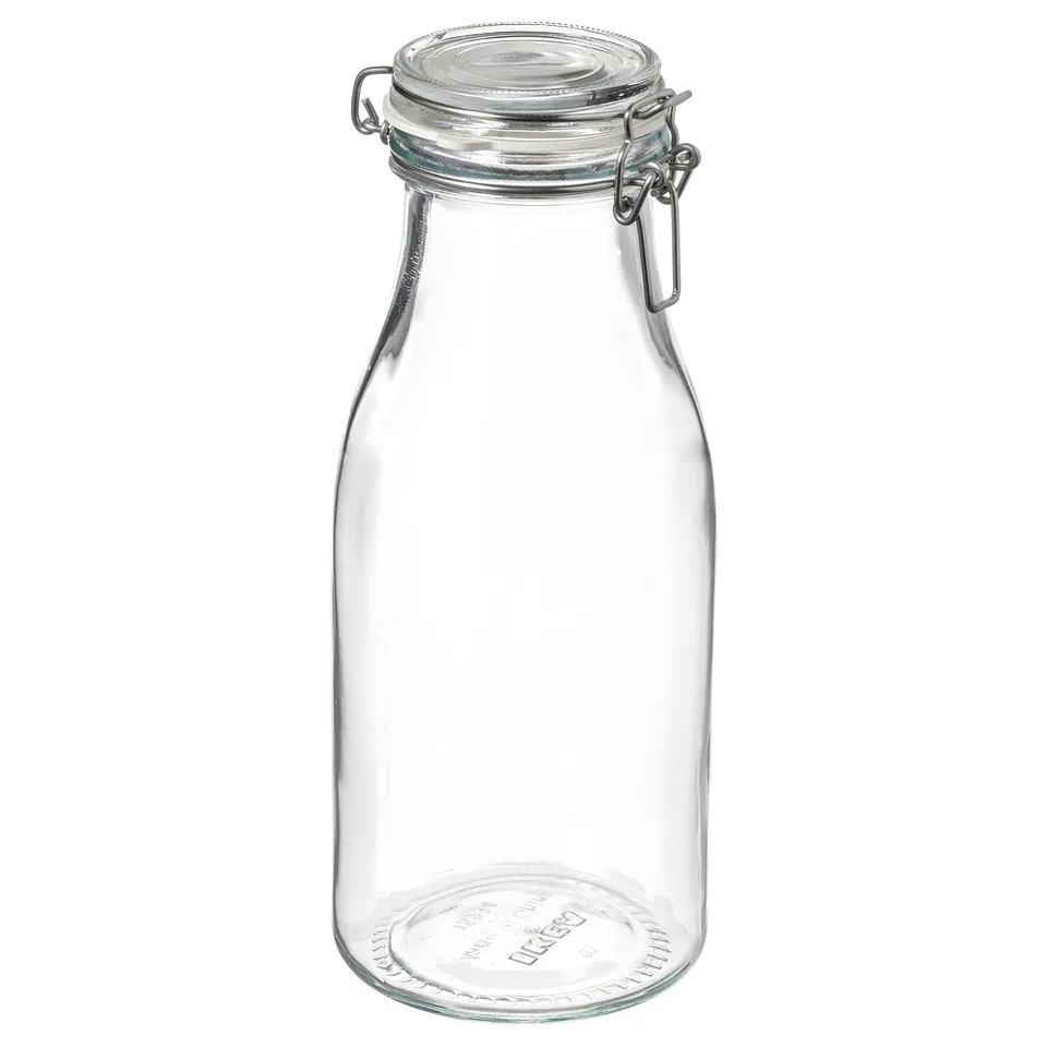 An empty KORKEN jar, clear and round with a metal clamp and rubber seal, suitable for preserving foods.
