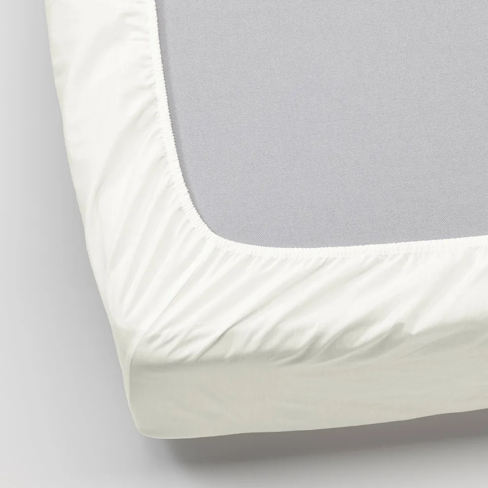 Crisp, white bed sheet with tight weave, fitted for thick mattress, displayed neatly.