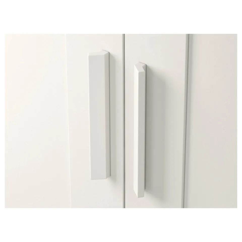 Two sleek, white wardrobe doors with modern handles, reflecting minimalist design.