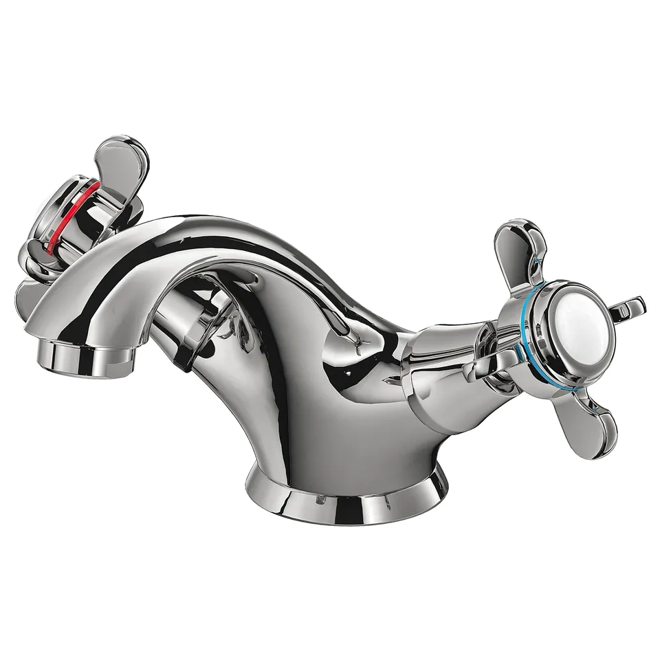 A chrome RUNSKÄR tap with cross handles, sleek and polished, made of brass.