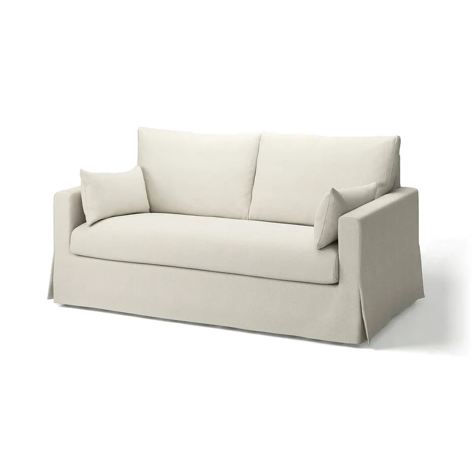 A beige HYLTARP sofa with a relaxed design, featuring removable, machine-washable covers made from linen and viscose blend.