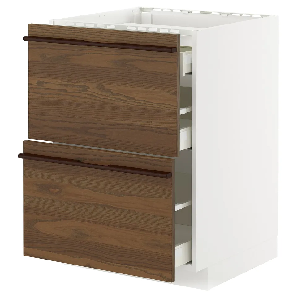 A METOD kitchen cabinet with dark brown stained ash veneer drawers and wooden handles, featuring a white frame.