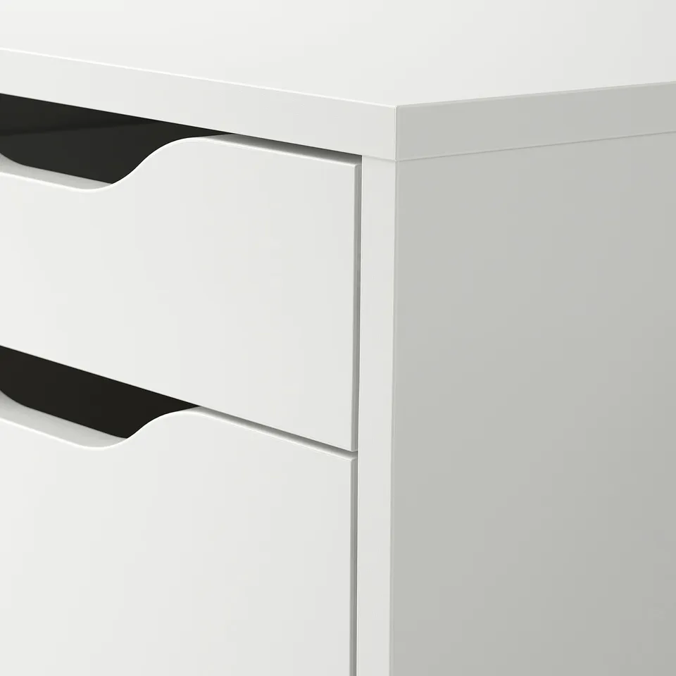 Modern white desk with sleek, black handles and smooth surfaces, showcasing high-quality design.
