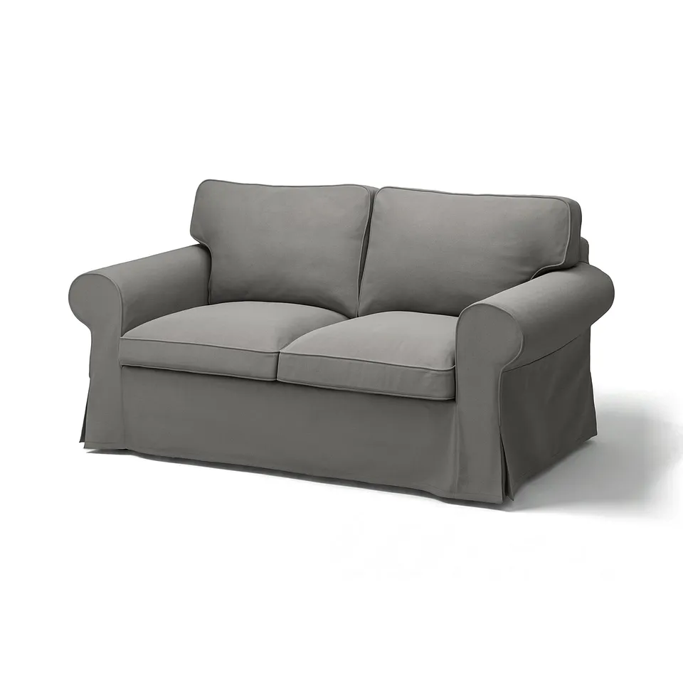 Grey EKTORP loveseat, soft fabric, rolled arms, plush cushions.