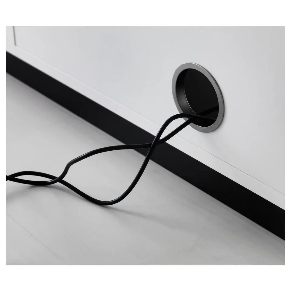Cord management system with back panel, keeping workspace organised and tidy.
