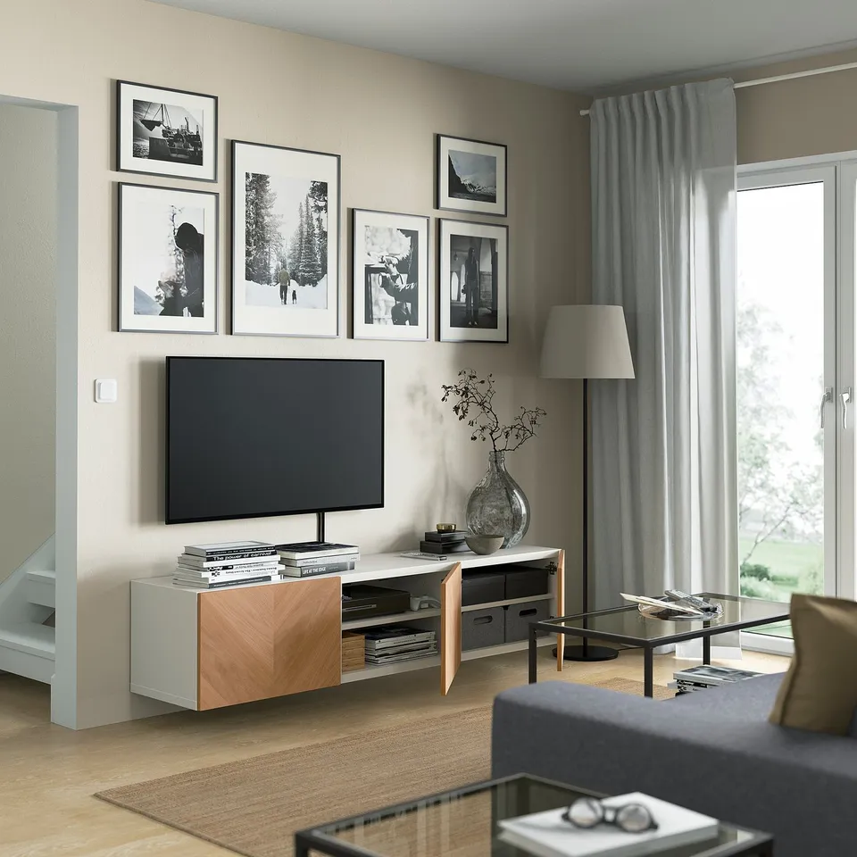 Modern living room with BESTÅ tv bench, featuring adjustable shelves, cable management, and wall-mounted design.