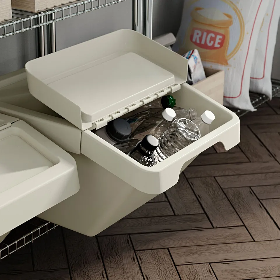 White plastic storage bin with a foldable lid, partially filled with small bottles and jars, sitting on wooden floor.