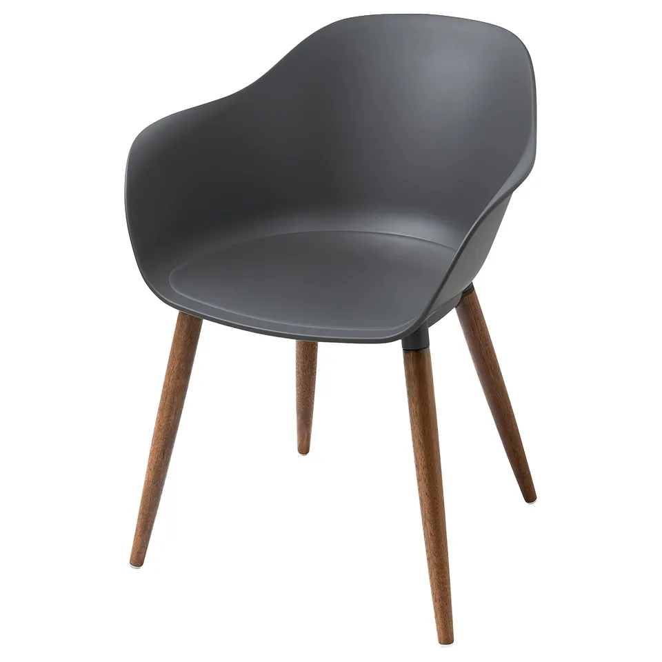 A grey GRÖNSTA chair with a curved seat and armrests, featuring wooden legs.