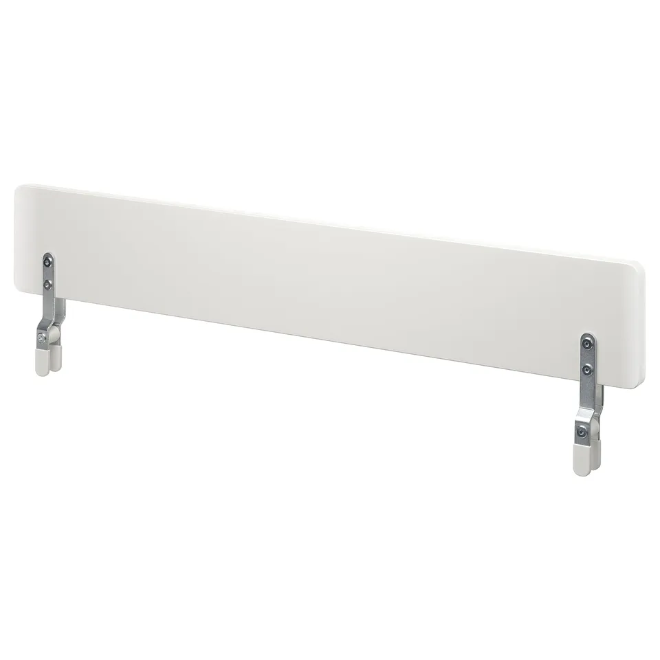 A white NATTAPA bed guardrail. Its rectangular, made of fibreboard with a smooth, painted surface, and has metal clips for attachment.