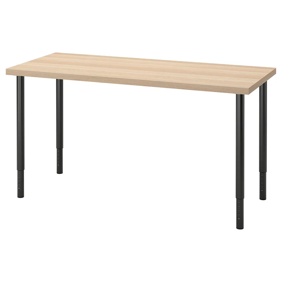 Depicts an LAGKAPTEN table with a light wood top and black metal legs.