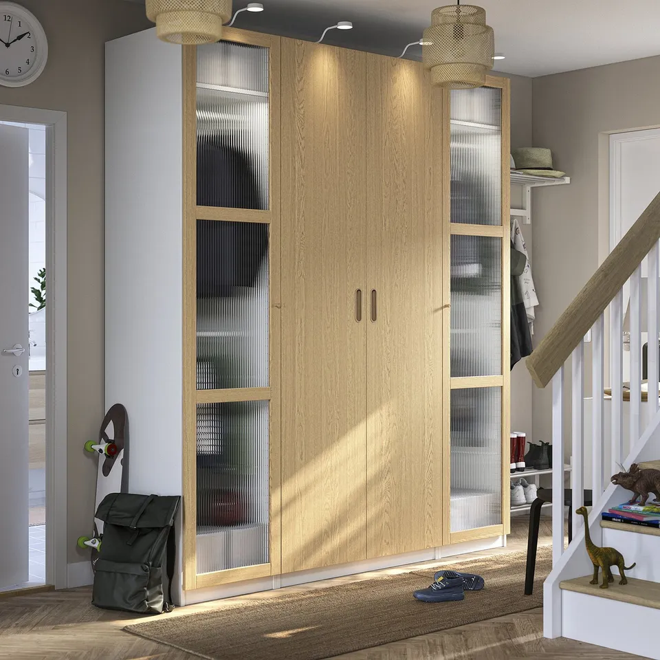 Wooden PAX wardrobe with glass, staircase, doormat, toys, and modern lights.