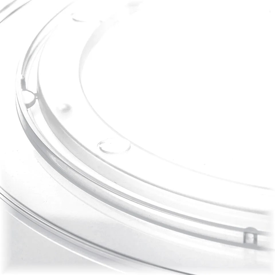 Clear plastic turntable for kitchen or fridge; smooth, transparent design with raised edges.