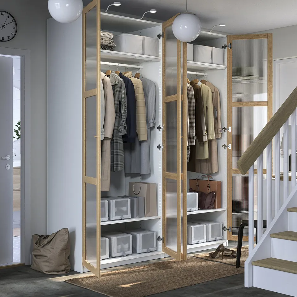 PAX wardrobe: minimalist, with hanging coats, bins, lighting, adjustable feet, and soft close hinges.