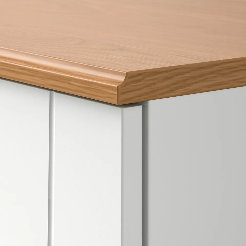 SKRUVBY table edge: smooth light wood meets grey panel, clean finish.